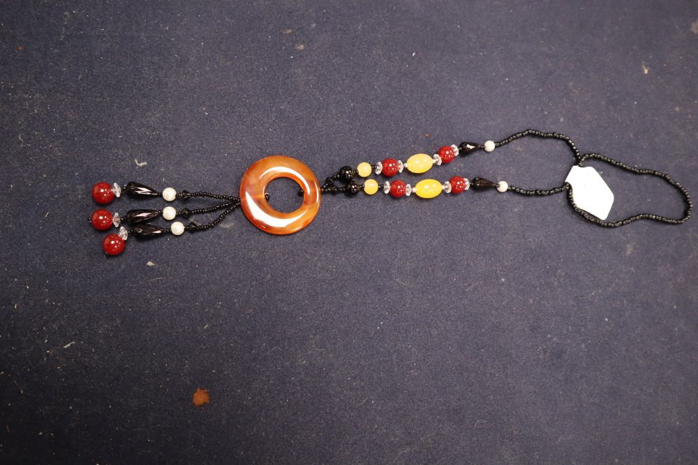 A large collection of glass bead and agate mounted necklaces